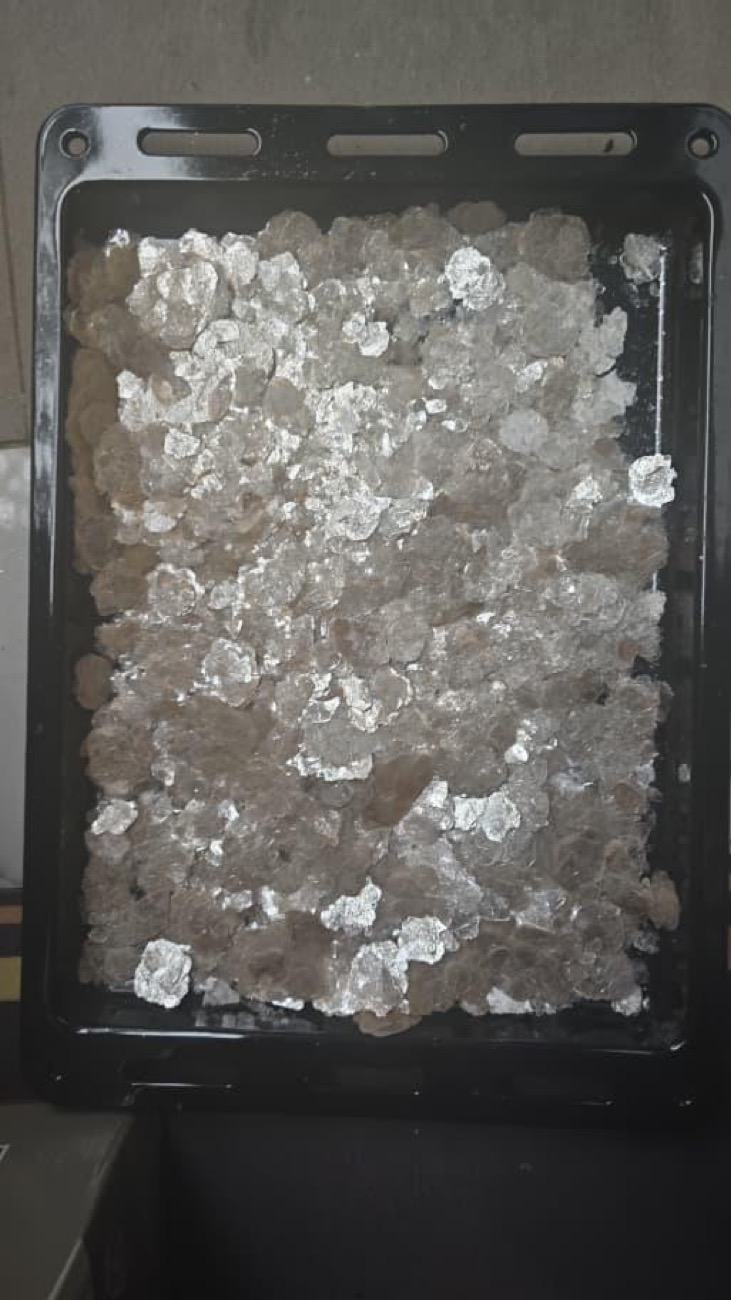 Tray of honey mica powder, packed for sample